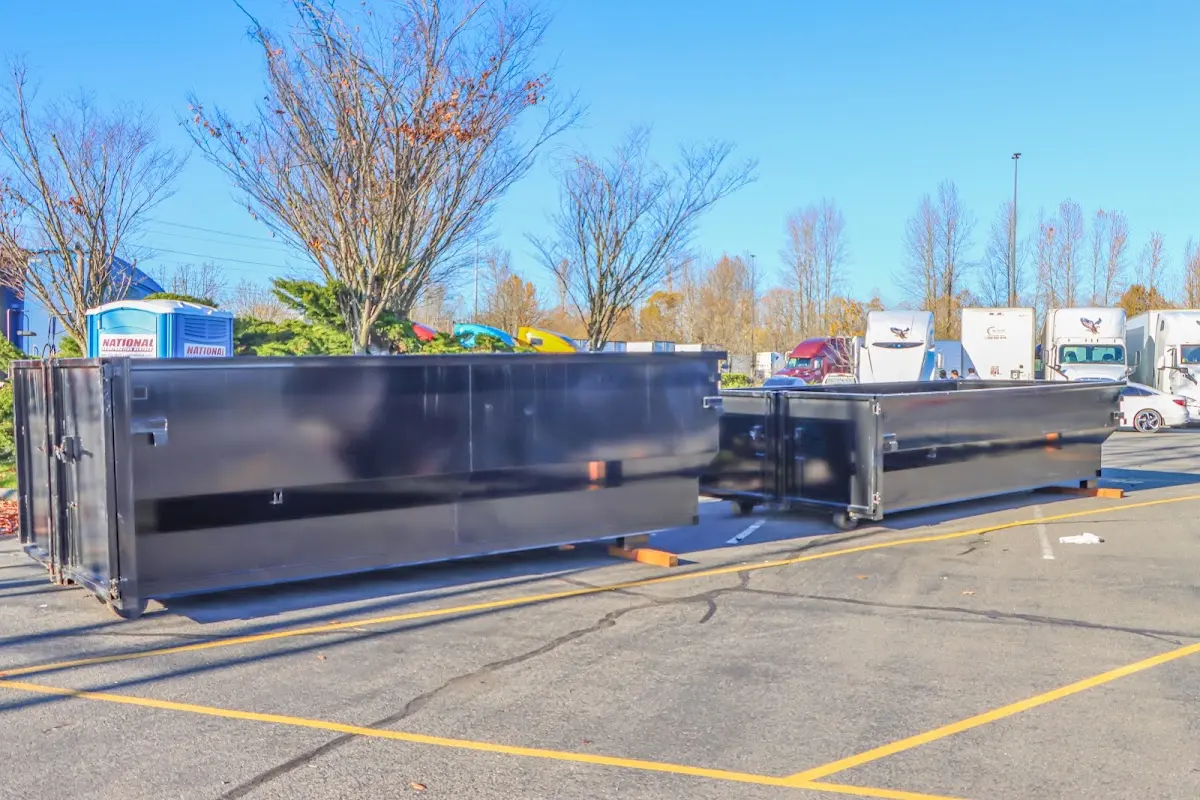 Professional dumpster rental service with roll-off container on residential driveway in Avra Valley